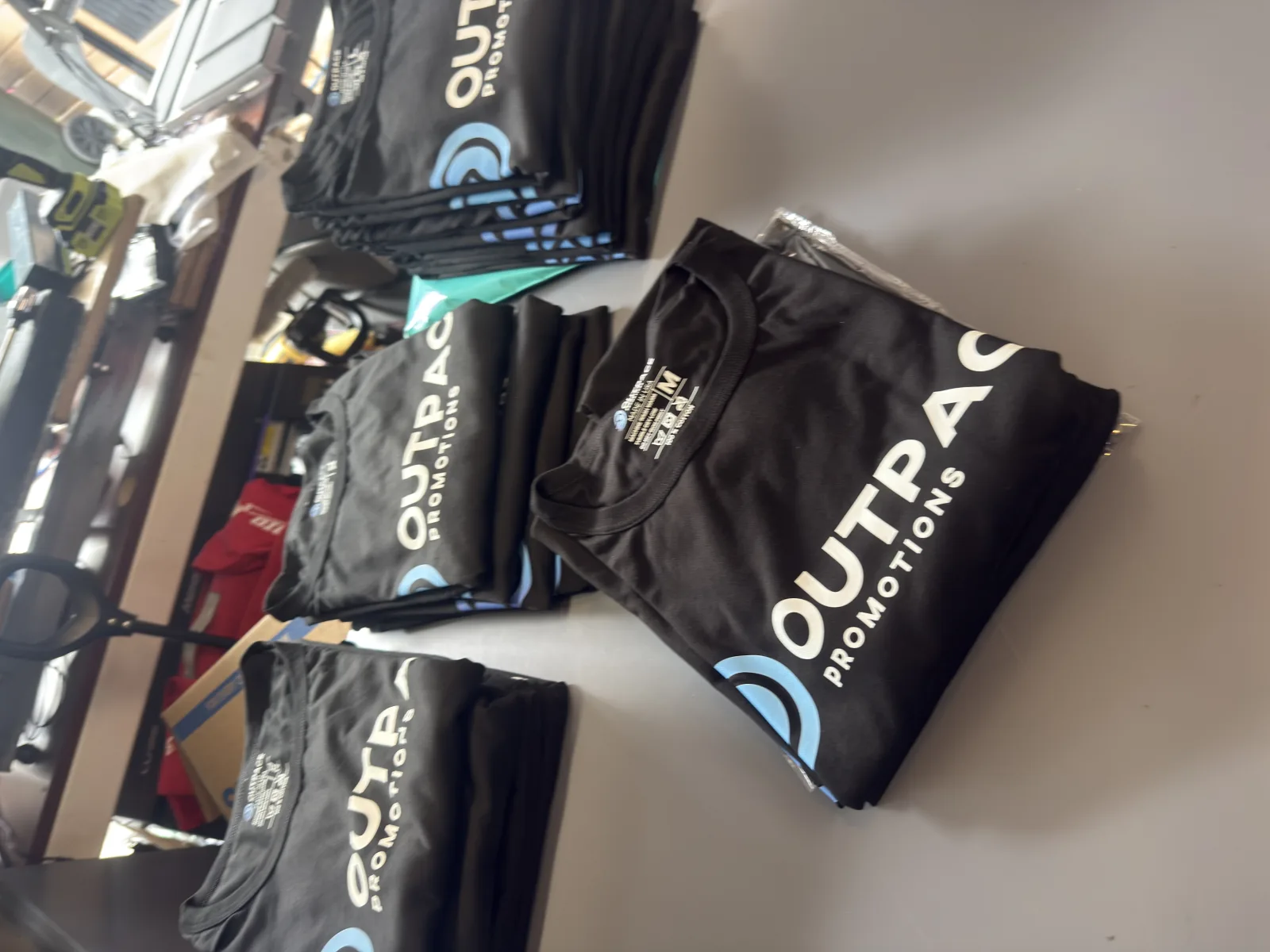 Outpace branded apparel with a logo detail